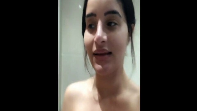 Arab girl in the shower shows her big tits and fat ass
