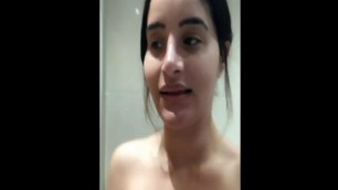 Arab girl in the shower shows her big tits and fat ass