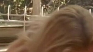 Blonde sucks on a big black cock on her knees outdoors then gets drilled