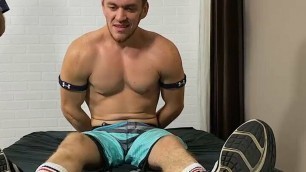 Restrained amateur endures having his body and feet tickled